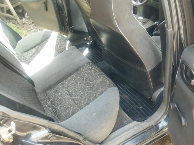 Черный Дэу Ланос, объемом двигателя 1.5 л и пробегом 298 тыс. км за 2603 $, фото 6 на Automoto.ua