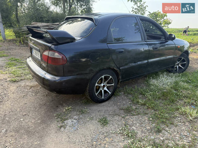 Черный Дэу Ланос, объемом двигателя 1.6 л и пробегом 275 тыс. км за 1700 $, фото 4 на Automoto.ua