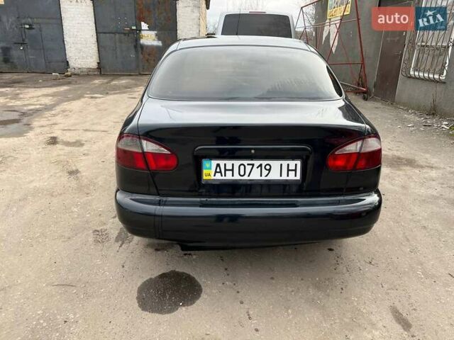 Чорний Деу Ланос, об'ємом двигуна 1.39 л та пробігом 200 тис. км за 1850 $, фото 1 на Automoto.ua