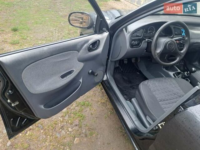 Черный Дэу Ланос, объемом двигателя 1.5 л и пробегом 158 тыс. км за 1250 $, фото 4 на Automoto.ua