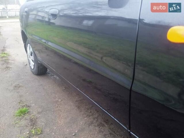Черный Дэу Ланос, объемом двигателя 1.5 л и пробегом 230 тыс. км за 2350 $, фото 5 на Automoto.ua
