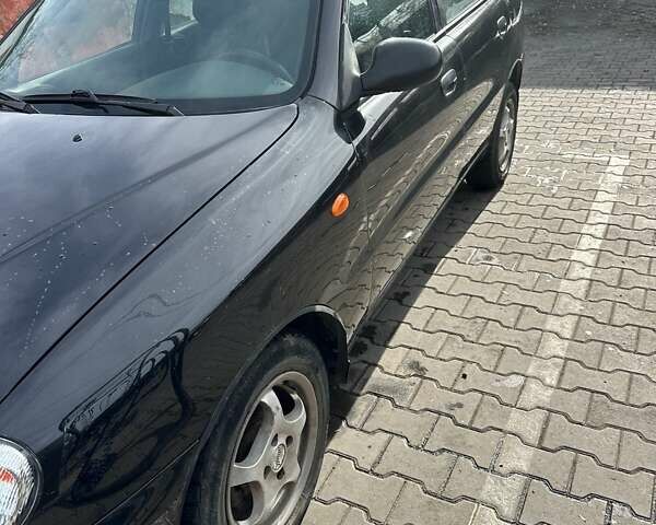 Чорний Деу Ланос, об'ємом двигуна 1.5 л та пробігом 230 тис. км за 3000 $, фото 3 на Automoto.ua