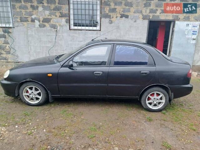 Черный Дэу Ланос, объемом двигателя 1.5 л и пробегом 158 тыс. км за 1250 $, фото 1 на Automoto.ua