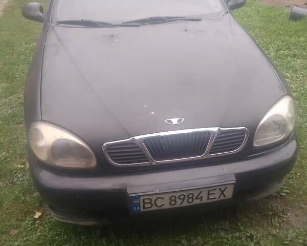Черный Дэу Ланос, объемом двигателя 1.5 л и пробегом 235 тыс. км за 1300 $, фото 1 на Automoto.ua