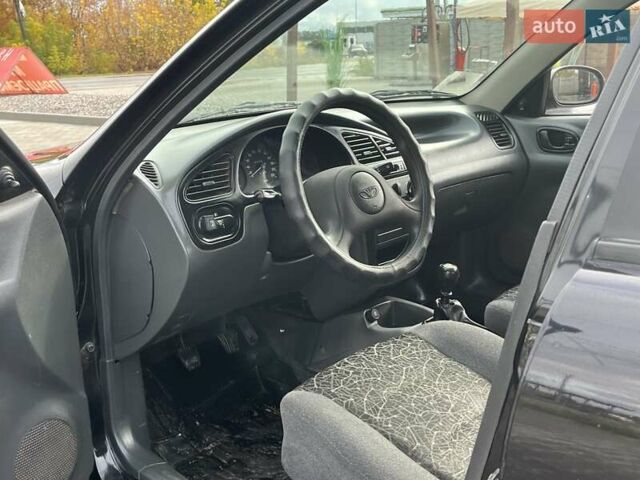 Черный Дэу Ланос, объемом двигателя 1.5 л и пробегом 105 тыс. км за 2450 $, фото 23 на Automoto.ua