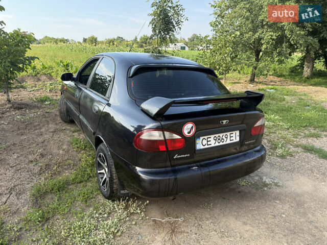 Черный Дэу Ланос, объемом двигателя 1.6 л и пробегом 275 тыс. км за 1700 $, фото 3 на Automoto.ua