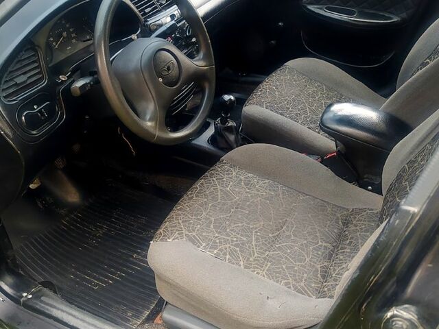 Черный Дэу Ланос, объемом двигателя 1.5 л и пробегом 536 тыс. км за 1000 $, фото 3 на Automoto.ua