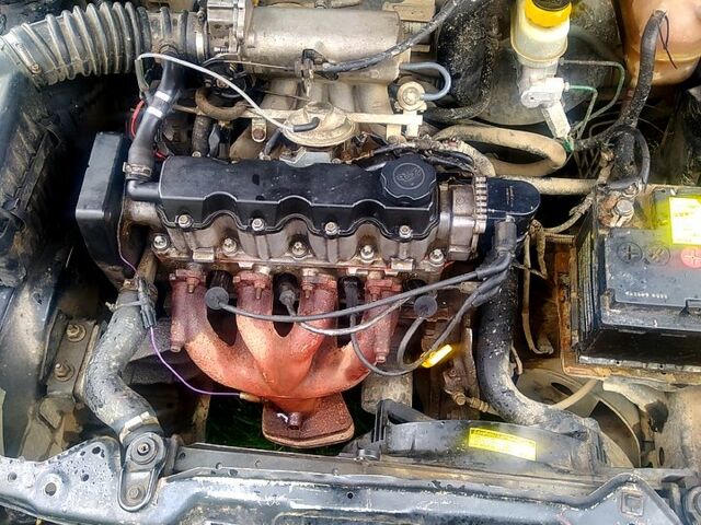 Черный Дэу Ланос, объемом двигателя 1.5 л и пробегом 536 тыс. км за 1000 $, фото 2 на Automoto.ua