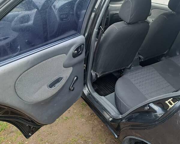 Черный Дэу Ланос, объемом двигателя 1.5 л и пробегом 158 тыс. км за 1250 $, фото 10 на Automoto.ua