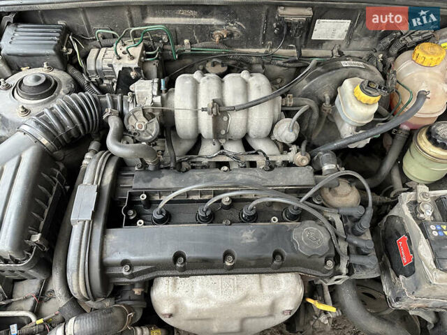 Черный Дэу Ланос, объемом двигателя 1.6 л и пробегом 140 тыс. км за 2700 $, фото 5 на Automoto.ua