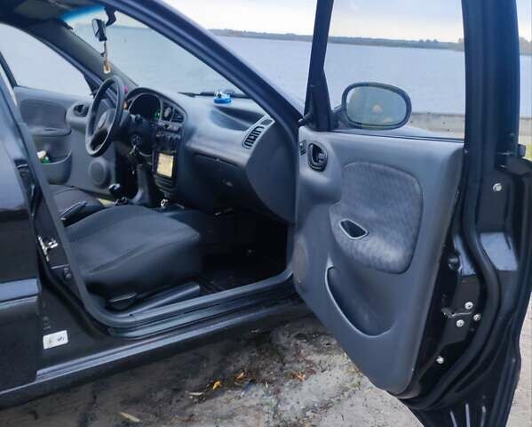 Черный Дэу Ланос, объемом двигателя 1.5 л и пробегом 289 тыс. км за 1700 $, фото 1 на Automoto.ua