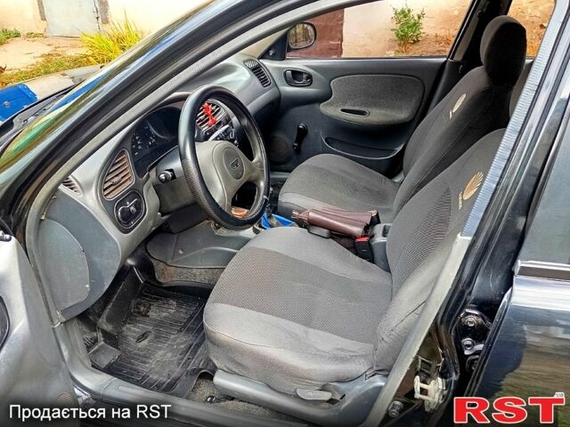 Черный Дэу Ланос, объемом двигателя 1.5 л и пробегом 337 тыс. км за 3000 $, фото 1 на Automoto.ua