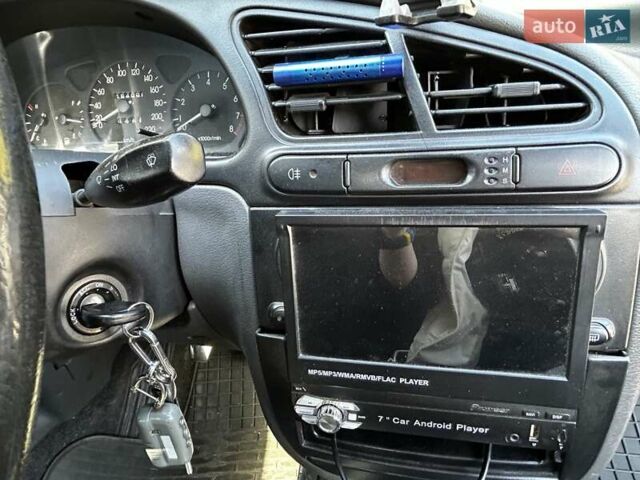 Черный Дэу Ланос, объемом двигателя 1.6 л и пробегом 154 тыс. км за 3500 $, фото 7 на Automoto.ua