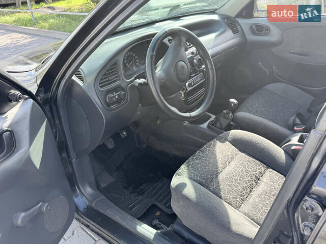 Черный Дэу Ланос, объемом двигателя 1.5 л и пробегом 190 тыс. км за 1400 $, фото 7 на Automoto.ua