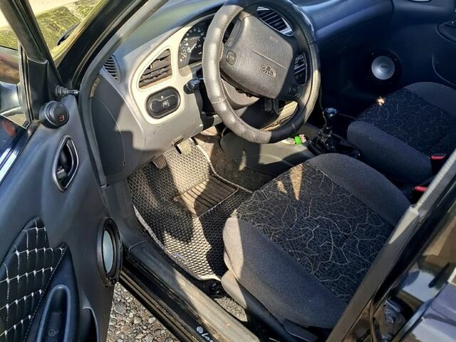 Черный Дэу Ланос, объемом двигателя 1.5 л и пробегом 217 тыс. км за 2800 $, фото 4 на Automoto.ua