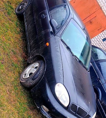 Черный Дэу Ланос, объемом двигателя 1.6 л и пробегом 200 тыс. км за 1700 $, фото 1 на Automoto.ua