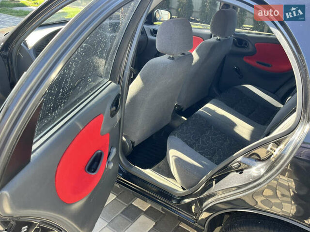 Чорний Деу Ланос, об'ємом двигуна 1.5 л та пробігом 180 тис. км за 2900 $, фото 12 на Automoto.ua