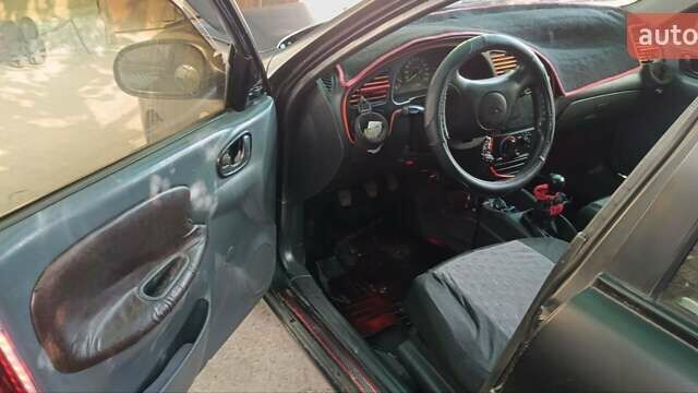 Черный Дэу Ланос, объемом двигателя 1.5 л и пробегом 236 тыс. км за 2300 $, фото 1 на Automoto.ua