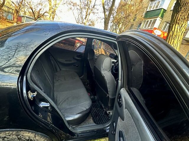 Чорний Деу Ланос, об'ємом двигуна 1.5 л та пробігом 363 тис. км за 1420 $, фото 5 на Automoto.ua