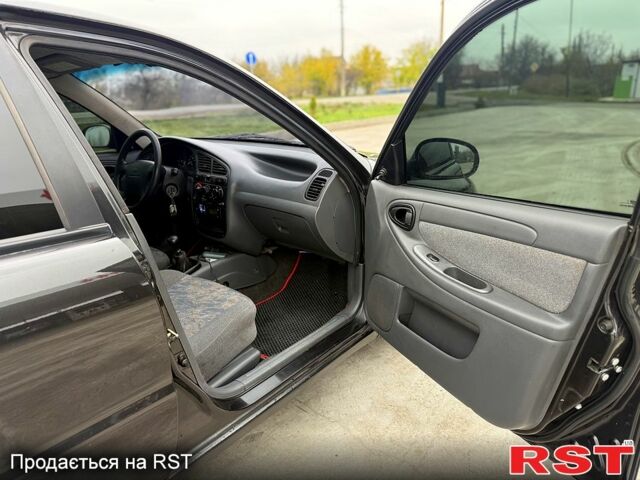 Чорний Деу Ланос, об'ємом двигуна 1.5 л та пробігом 240 тис. км за 2750 $, фото 7 на Automoto.ua