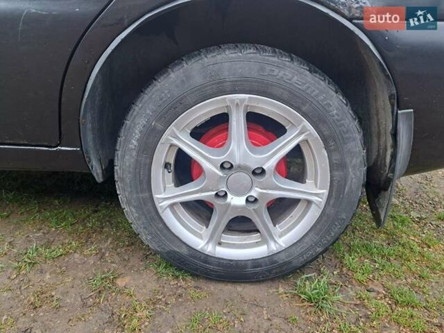 Черный Дэу Ланос, объемом двигателя 1.5 л и пробегом 158 тыс. км за 1250 $, фото 3 на Automoto.ua