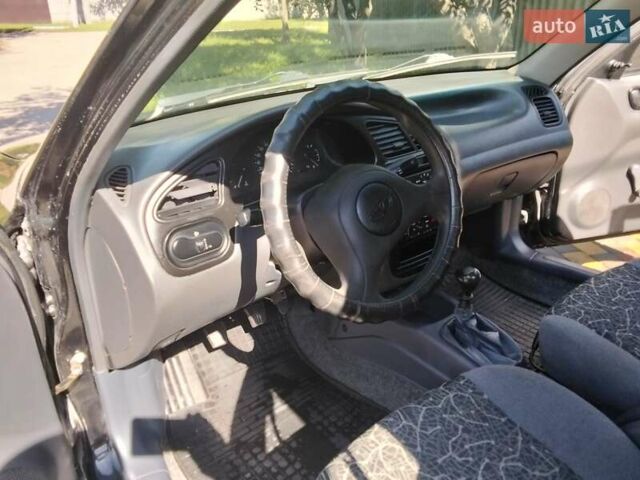Чорний Деу Ланос, об'ємом двигуна 1.5 л та пробігом 255 тис. км за 2300 $, фото 4 на Automoto.ua