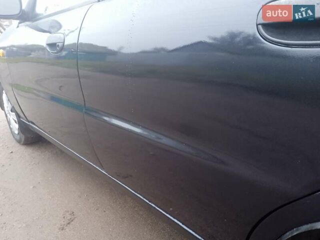 Черный Дэу Ланос, объемом двигателя 1.5 л и пробегом 230 тыс. км за 2350 $, фото 7 на Automoto.ua