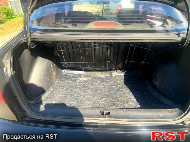 Черный Дэу Ланос, объемом двигателя 1.5 л и пробегом 255 тыс. км за 3200 $, фото 5 на Automoto.ua