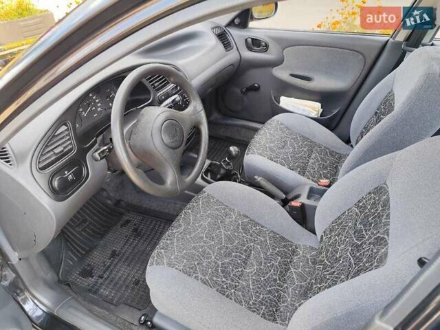 Черный Дэу Ланос, объемом двигателя 1.5 л и пробегом 81 тыс. км за 3800 $, фото 7 на Automoto.ua