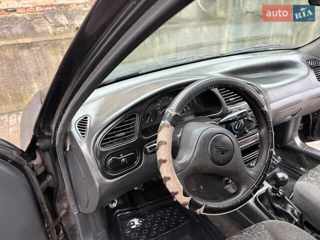 Черный Дэу Ланос, объемом двигателя 0 л и пробегом 150 тыс. км за 1250 $, фото 11 на Automoto.ua