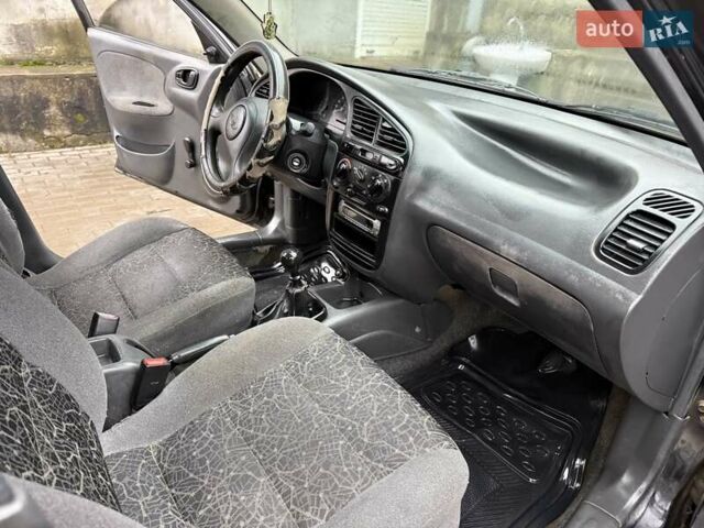 Черный Дэу Ланос, объемом двигателя 0 л и пробегом 150 тыс. км за 1250 $, фото 1 на Automoto.ua