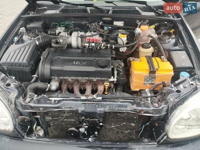 Черный Дэу Ланос, объемом двигателя 1.6 л и пробегом 200 тыс. км за 1499 $, фото 6 на Automoto.ua