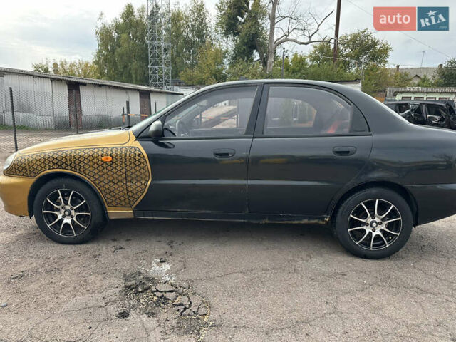 Черный Дэу Ланос, объемом двигателя 1.6 л и пробегом 214 тыс. км за 2350 $, фото 2 на Automoto.ua