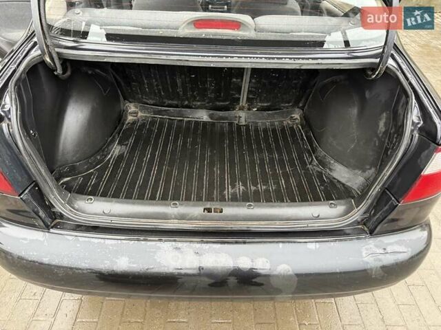 Черный Дэу Ланос, объемом двигателя 0 л и пробегом 150 тыс. км за 1250 $, фото 23 на Automoto.ua