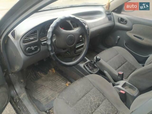 Чорний Деу Ланос, об'ємом двигуна 0 л та пробігом 215 тис. км за 1000 $, фото 1 на Automoto.ua