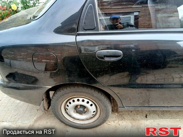 Черный Дэу Ланос, объемом двигателя 1.4 л и пробегом 144 тыс. км за 2100 $, фото 4 на Automoto.ua