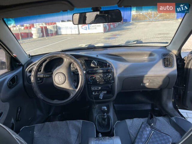 Черный Дэу Ланос, объемом двигателя 1.4 л и пробегом 177 тыс. км за 1750 $, фото 6 на Automoto.ua