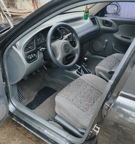 Черный Дэу Ланос, объемом двигателя 1.5 л и пробегом 130 тыс. км за 2700 $, фото 5 на Automoto.ua