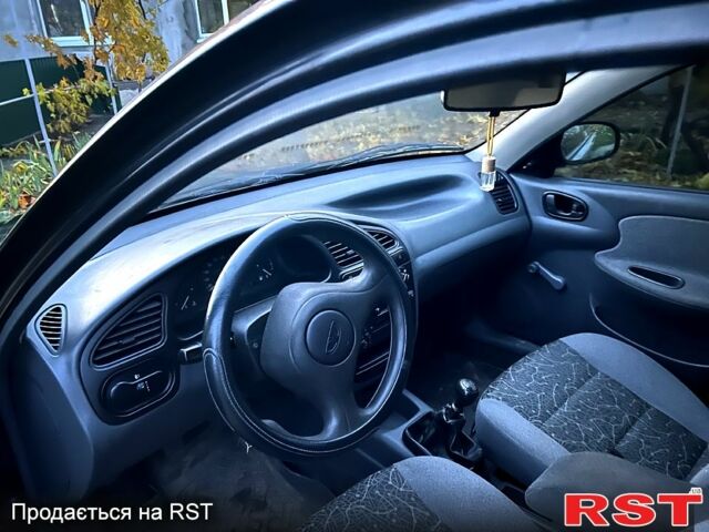 Черный Дэу Ланос, объемом двигателя 1.4 л и пробегом 220 тыс. км за 1800 $, фото 7 на Automoto.ua