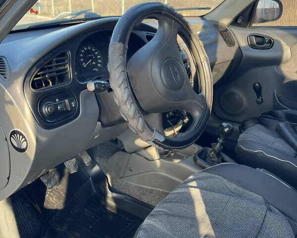 Черный Дэу Ланос, объемом двигателя 1.4 л и пробегом 177 тыс. км за 1750 $, фото 8 на Automoto.ua