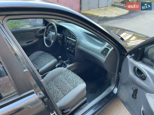 Черный Дэу Ланос, объемом двигателя 1.4 л и пробегом 233 тыс. км за 2500 $, фото 24 на Automoto.ua