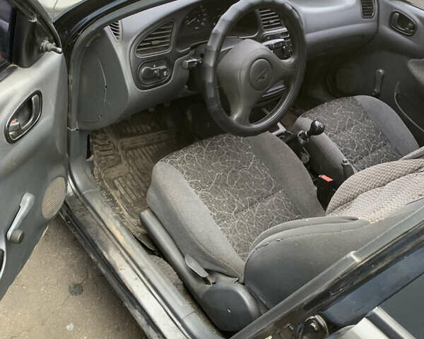 Черный Дэу Ланос, объемом двигателя 1.5 л и пробегом 119 тыс. км за 2700 $, фото 5 на Automoto.ua