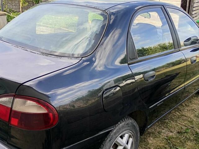 Черный Дэу Ланос, объемом двигателя 1.5 л и пробегом 171 тыс. км за 1600 $, фото 3 на Automoto.ua