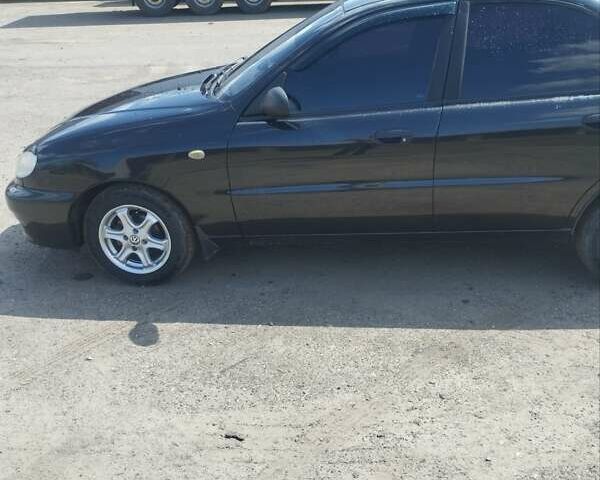 Черный Дэу Ланос, объемом двигателя 1.5 л и пробегом 153 тыс. км за 2700 $, фото 1 на Automoto.ua