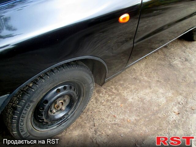 Черный Дэу Ланос, объемом двигателя 1.5 л и пробегом 230 тыс. км за 2000 $, фото 6 на Automoto.ua