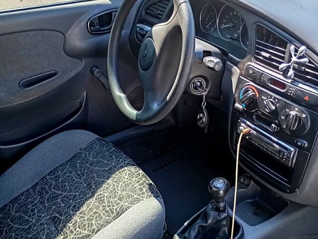 Черный Дэу Ланос, объемом двигателя 1.4 л и пробегом 200 тыс. км за 1600 $, фото 1 на Automoto.ua