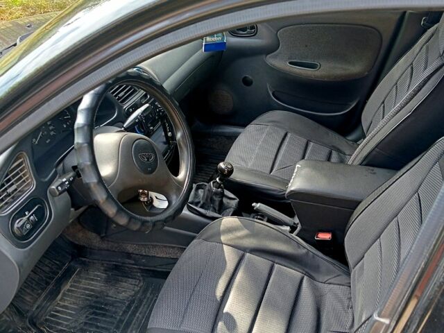 Черный Дэу Ланос, объемом двигателя 1.5 л и пробегом 213 тыс. км за 2400 $, фото 5 на Automoto.ua