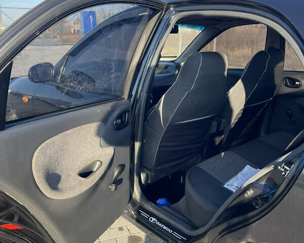 Черный Дэу Ланос, объемом двигателя 1.4 л и пробегом 177 тыс. км за 1750 $, фото 9 на Automoto.ua