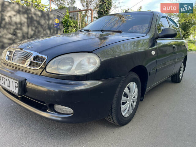 Черный Дэу Ланос, объемом двигателя 1.5 л и пробегом 234 тыс. км за 2400 $, фото 1 на Automoto.ua