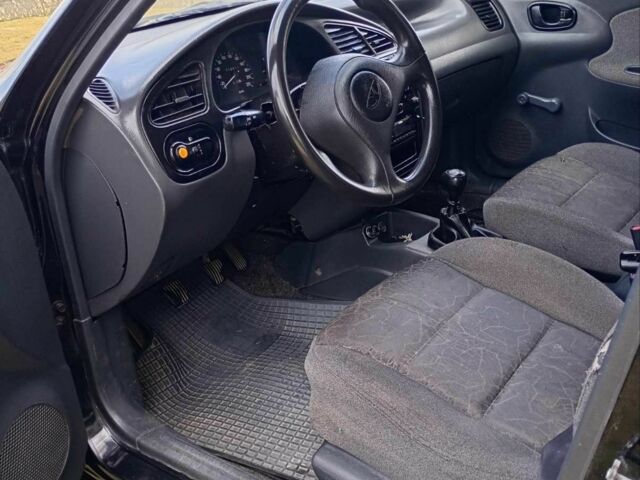 Черный Дэу Ланос, объемом двигателя 1.5 л и пробегом 171 тыс. км за 1600 $, фото 9 на Automoto.ua